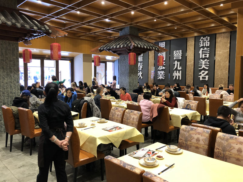 Jinli Chinatown dining room with lanterns and tables